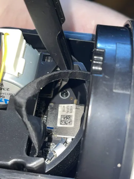 Tweezer bridging the GND and boot pins, view 1